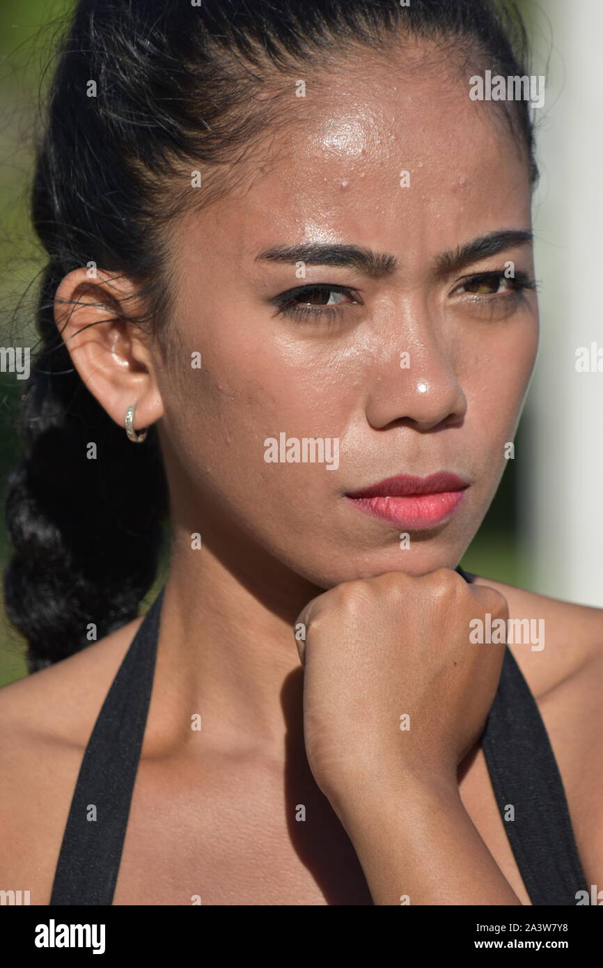 Beautiful Filipina Woman Thinking Stock Photo