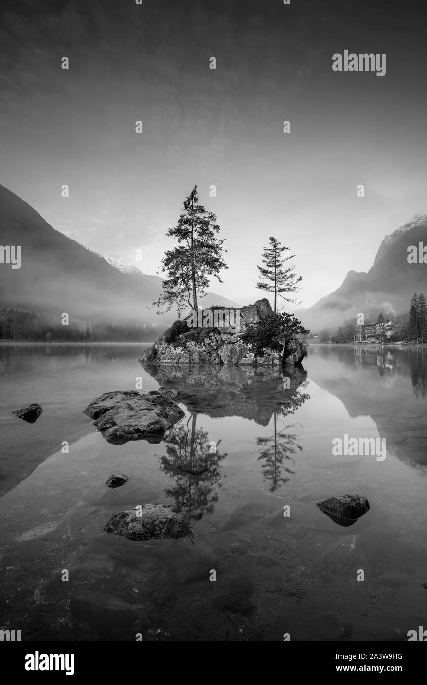 Lake Hintersee, German Alps, Germany. Black and white image of Lake Hintersee located in southern Bavaria, Germany during autumn sunrise. Stock Photo