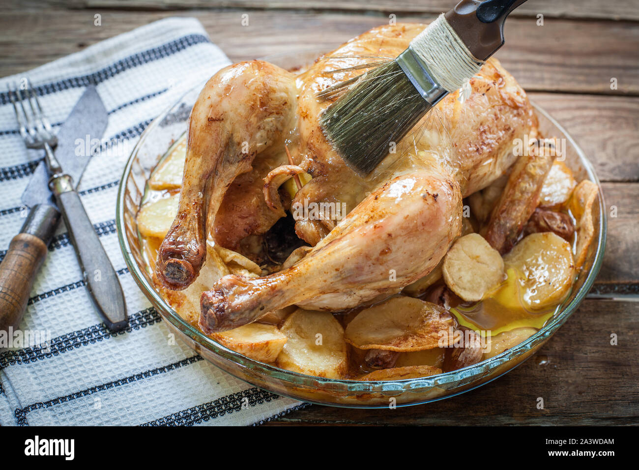 Homemade chicken roasted with potato on tray Stock Photo - Alamy