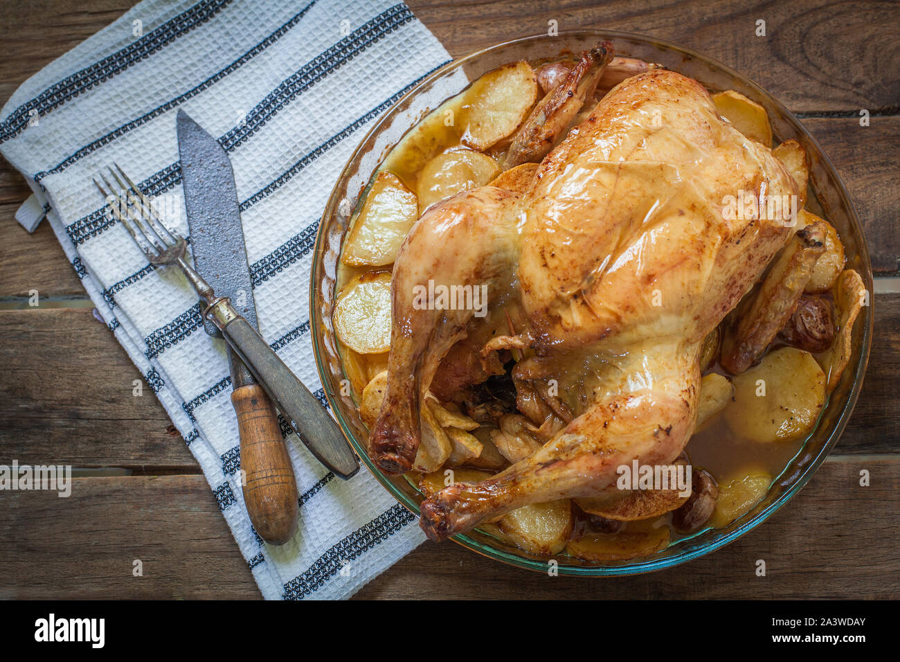 Homemade chicken roasted with potato on tray Stock Photo - Alamy