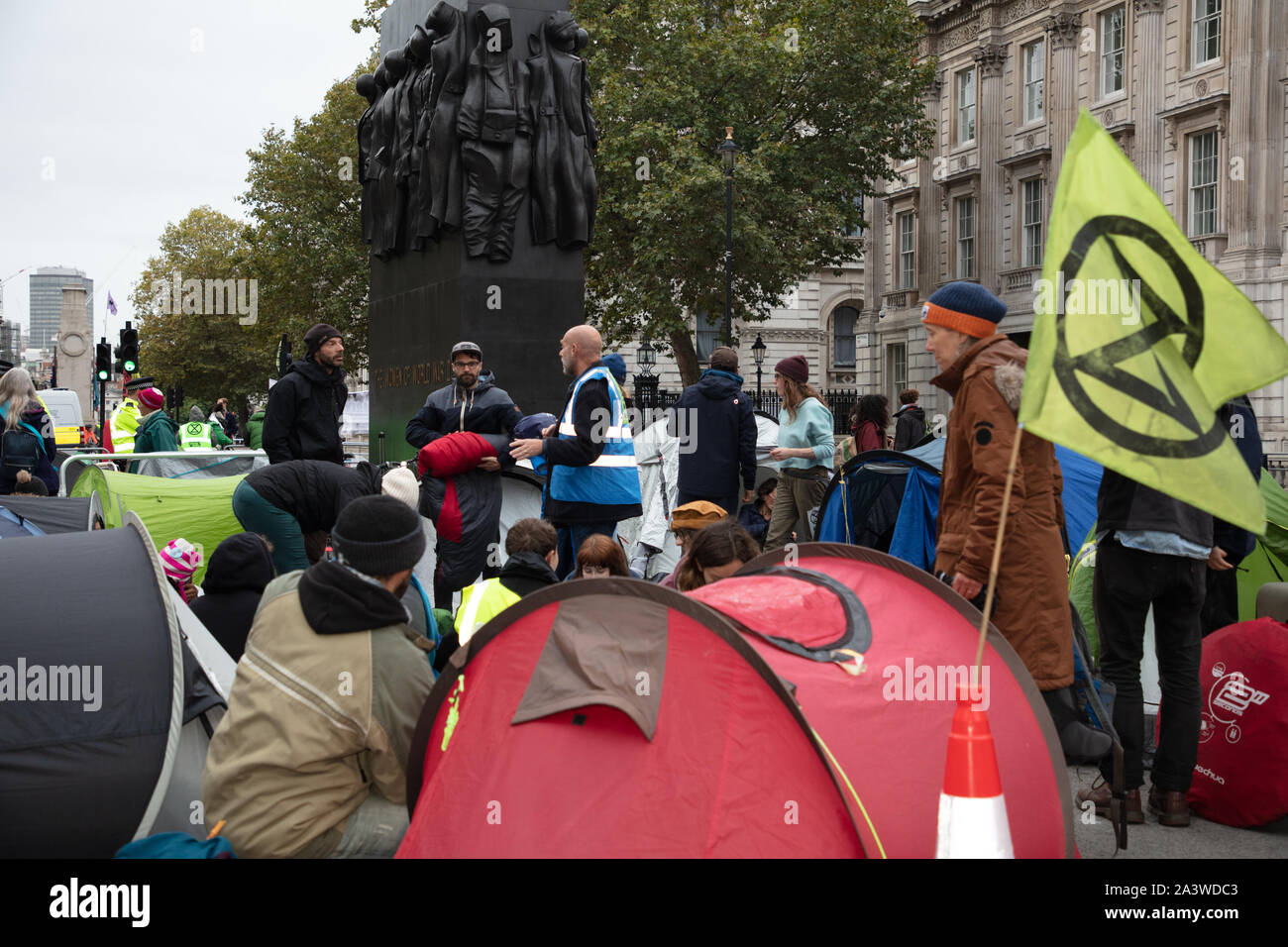 London, UK. 9th October 2019. Demonstrators seen near Downing Street in the early morning, during the Extinction Rebellion two week long protest in London. Credit: Joe Kuis / Alamy News Stock Photo