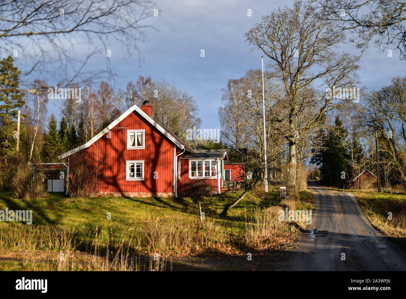 Sweden: Hokerum. Rural landscape, Ulricehamn Municipality, Vastra Gotaland County. Traditional Swedish wooden house with red and white facades on the Stock Photo