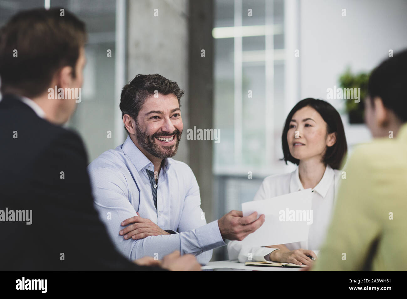 Corporate business executives celebrating success in a meeting Stock Photo
