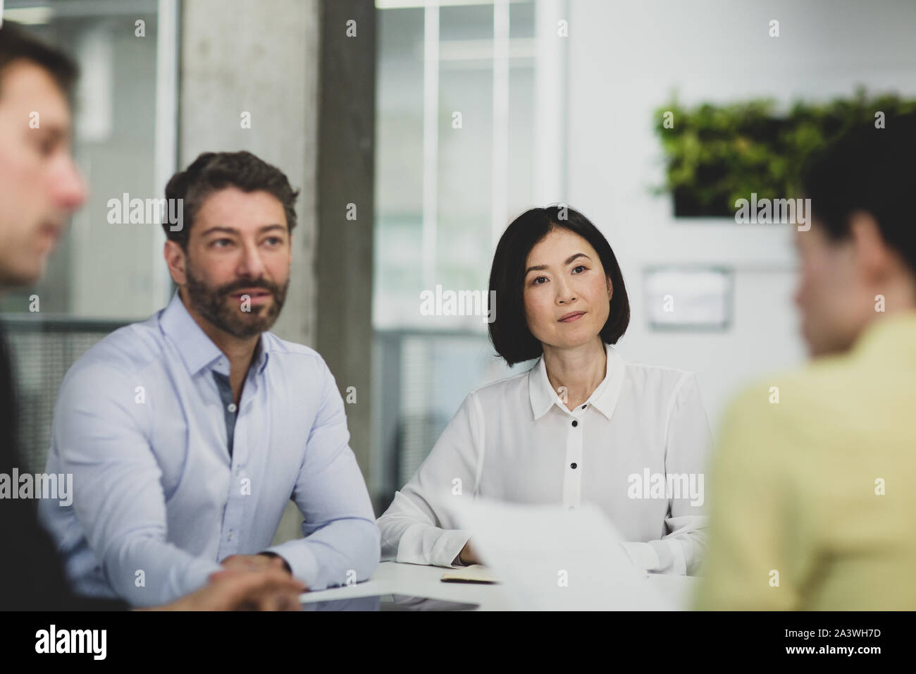 Corporate business executives listening in a board meeting Stock Photo