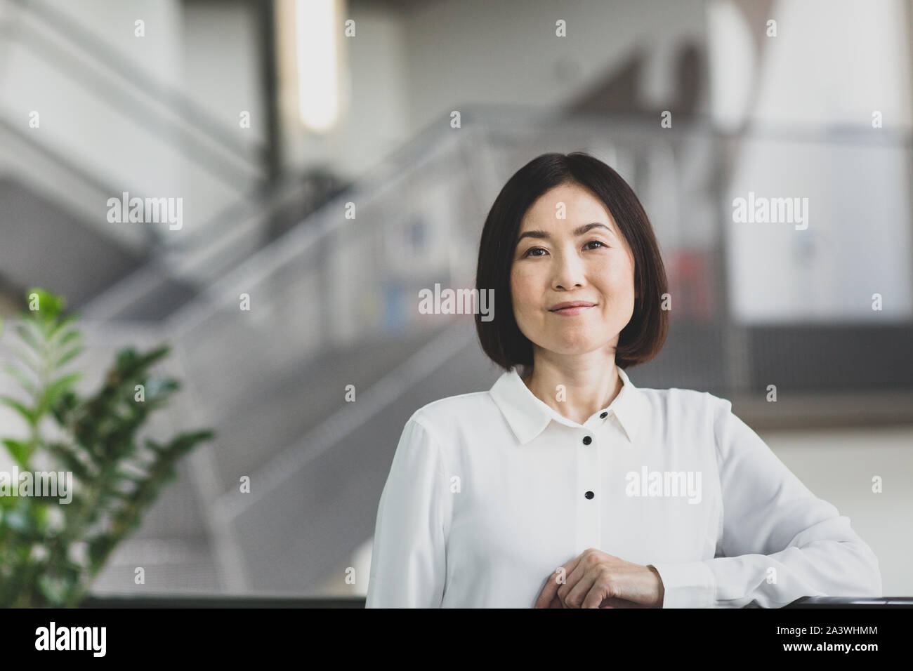 Portrait of Japanese businesswoman in corporate office Stock Photo