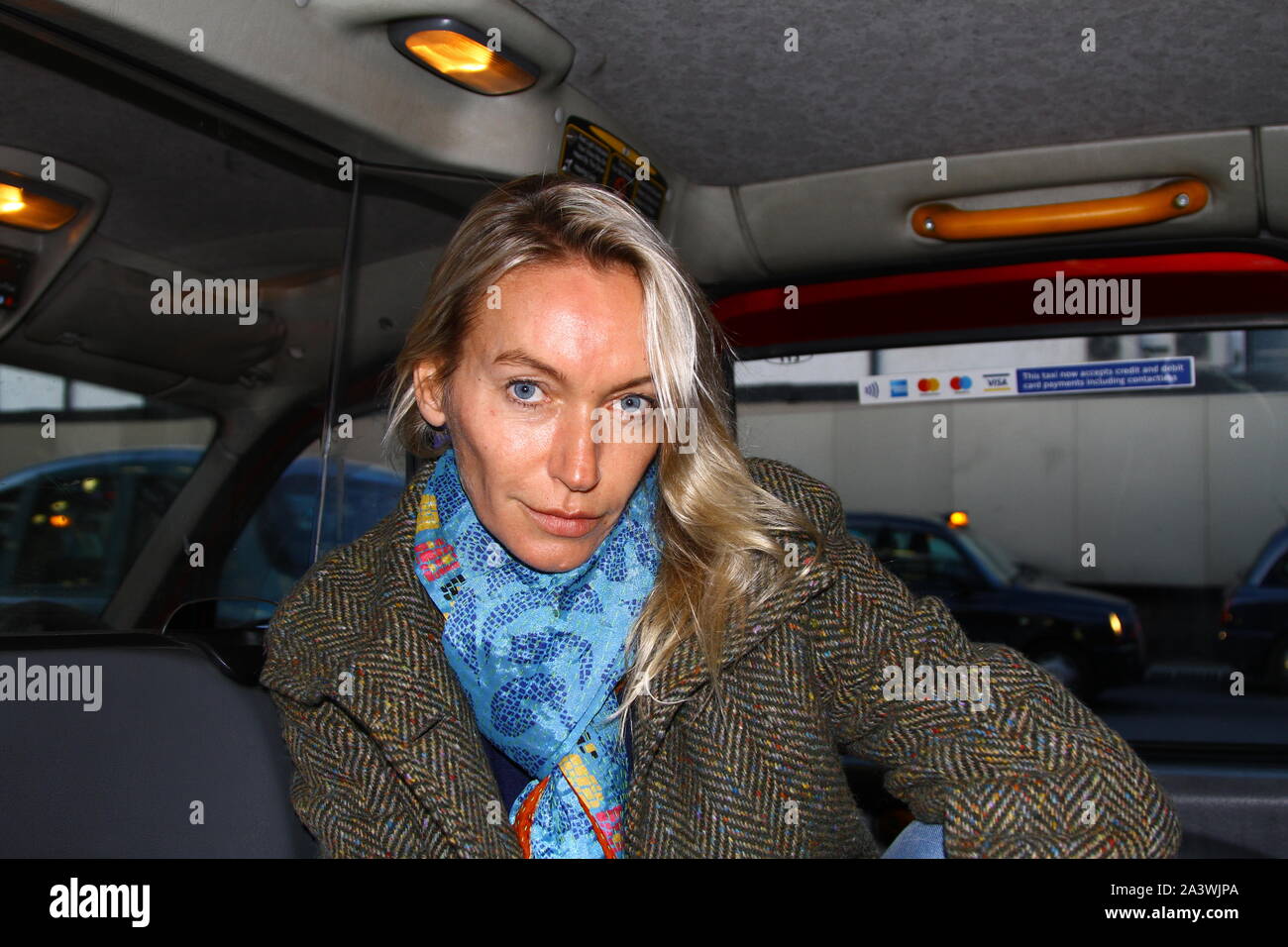 Lisa Hilton Author name L S Hilton pictured in the back of a London Taxi cab at Paddington station on 9th October 2019.Lisa Hilton is a British writer of history books and historical fiction. Lisa gave her consent for this photograph to be taken of her for the stock photo image site alamy.com Stock Photo