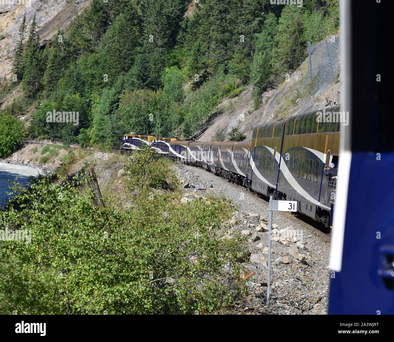 The Rocky Mountaineer rounding the curve, a good view of silver and gold class carriages. Stock Photo