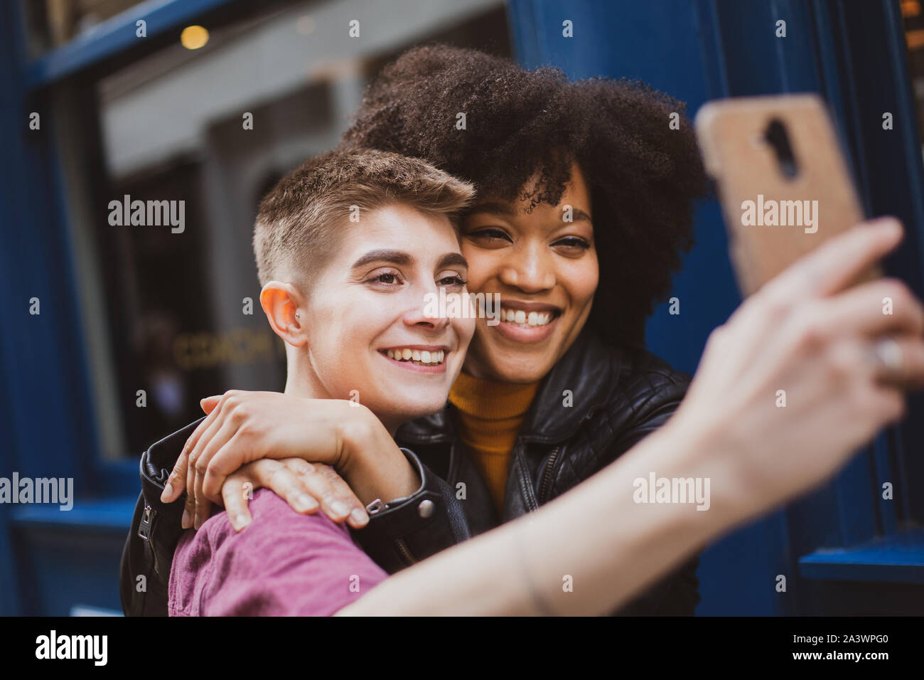Young adult lesbian couple taking selfie in London Stock Photo