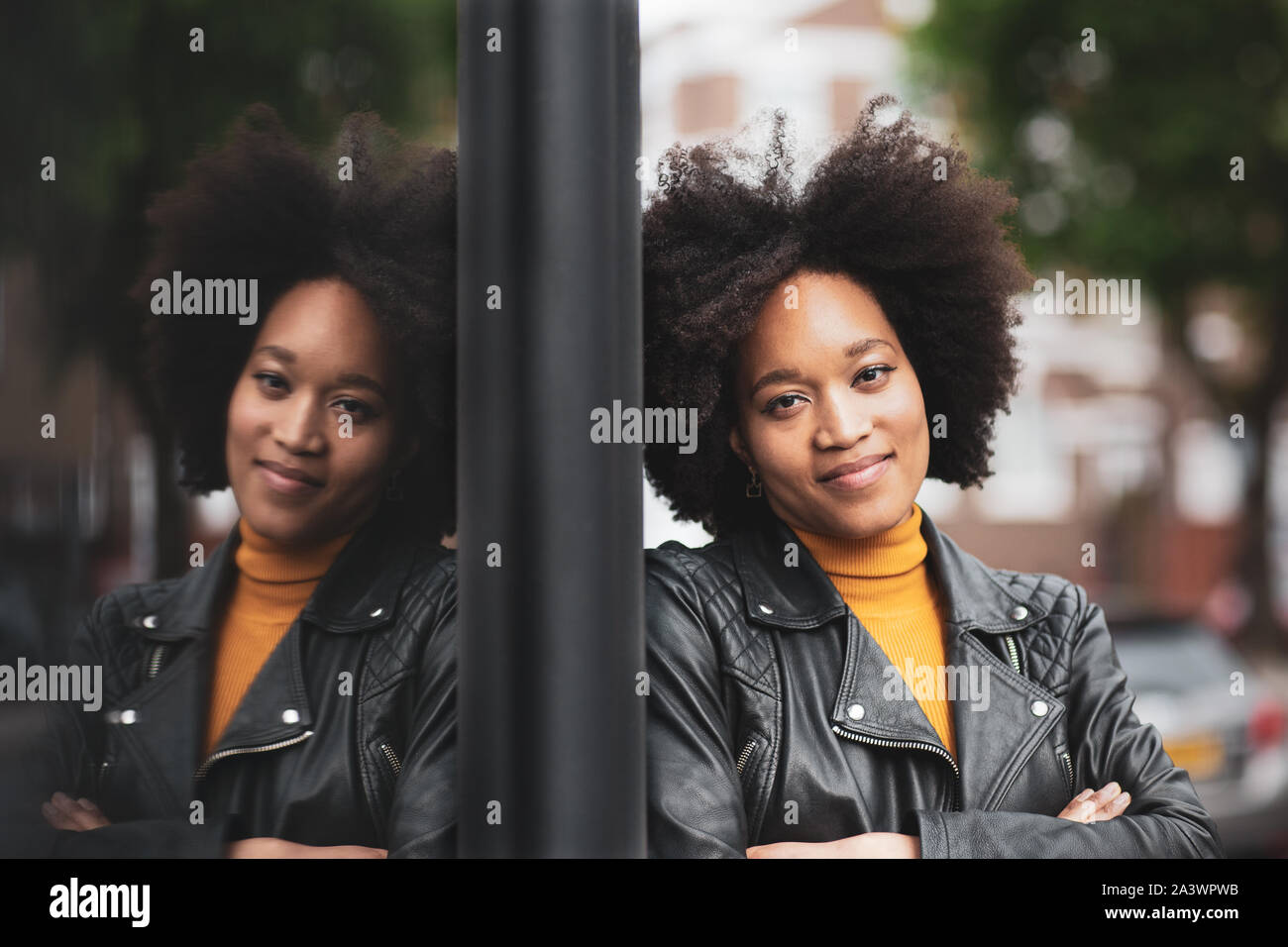 Portrait of African American young adult female with reflection Stock Photo