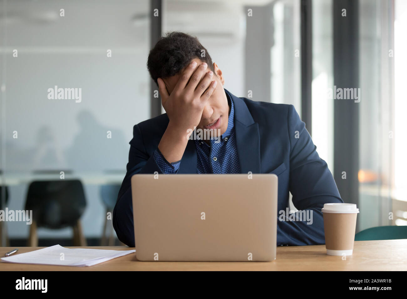 Frustrated upset black business man stressed about financial market crisis Stock Photo