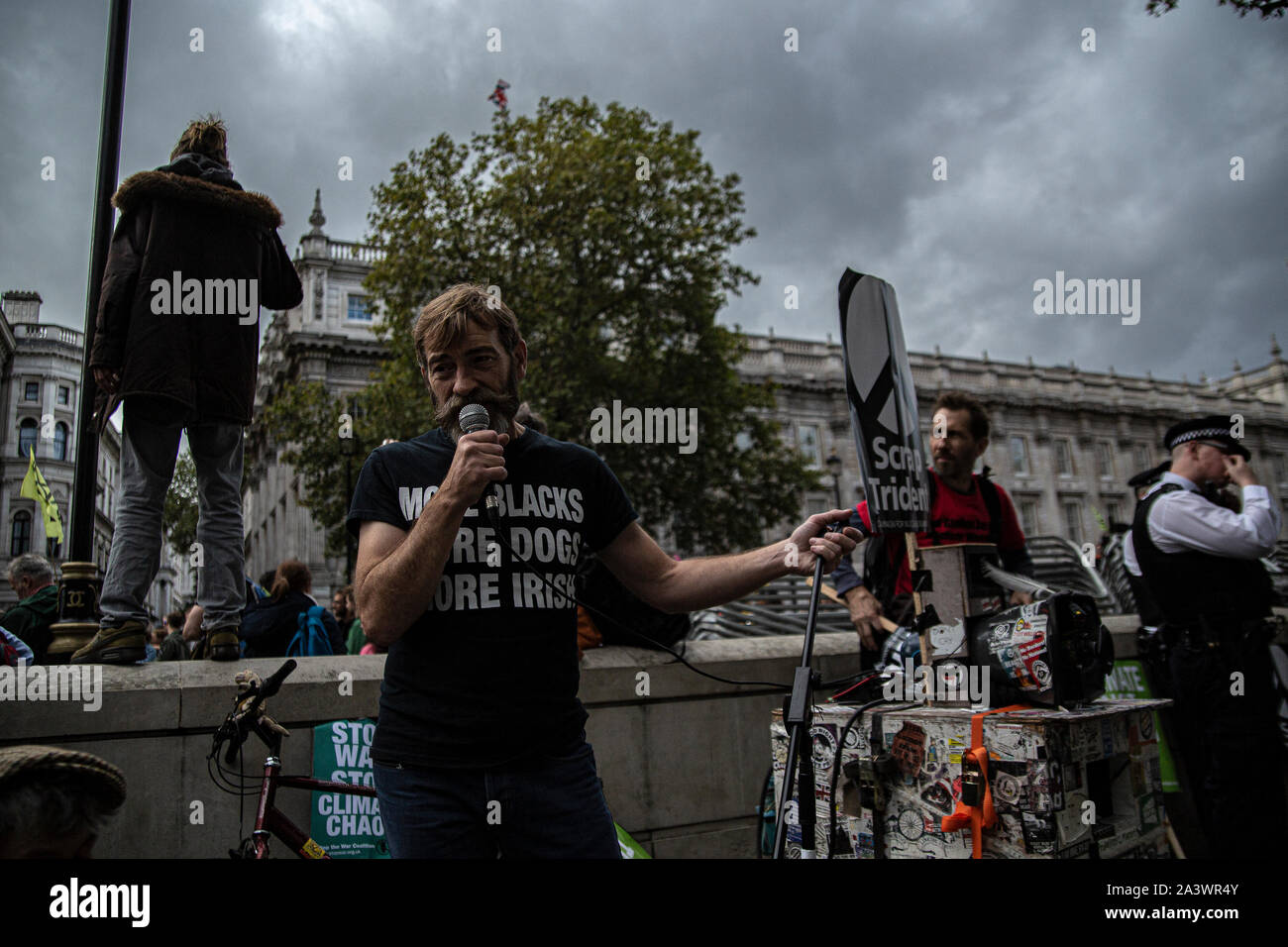 A man performs during the protest.Protesters took to the street in central London across this week and next week to highlight the 'climate emergency' facing the planet. Stock Photo