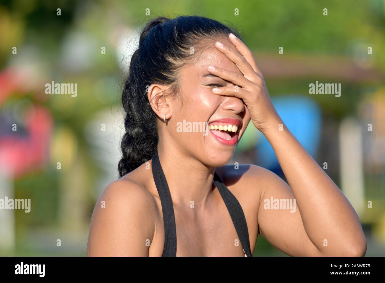 Young Minority Female Laughing Stock Photo