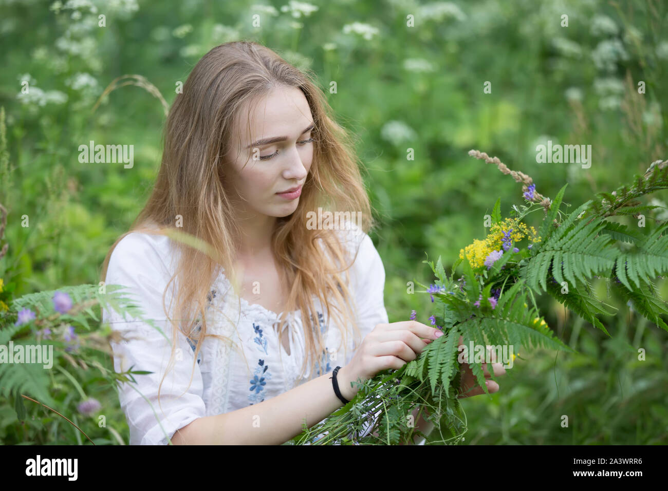 https://c8.alamy.com/comp/2A3WRR6/belarus-the-city-of-gomel-july-07-2018-holiday-kupala-the-girl-weaves-a-wreath-for-the-kupala-night-slavic-summer-holidays-belarusian-or-ukrain-2A3WRR6.jpg