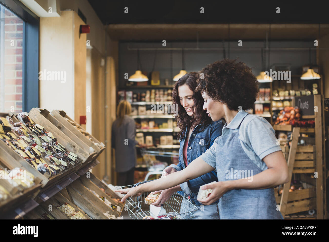 Customer asking for help in a grocery store Stock Photo