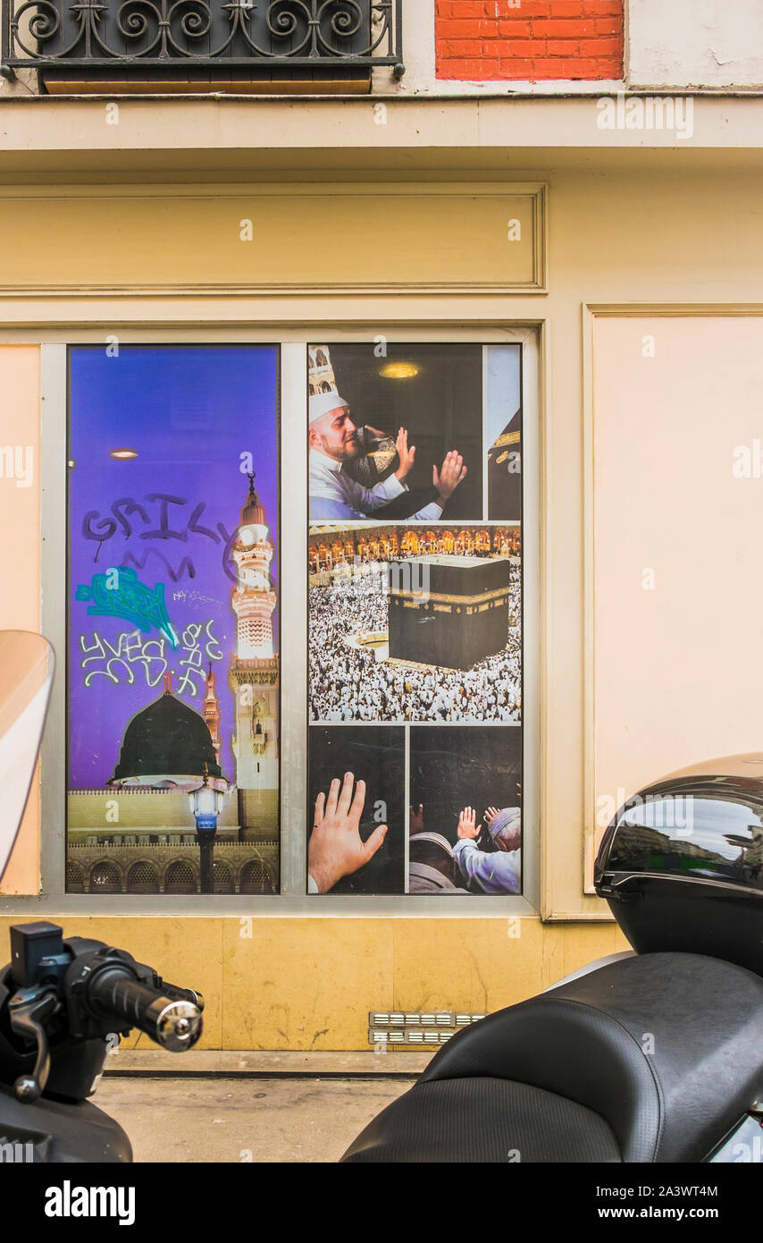 photographs of muslim pilgrims at the kaaba, shop window display Stock Photo