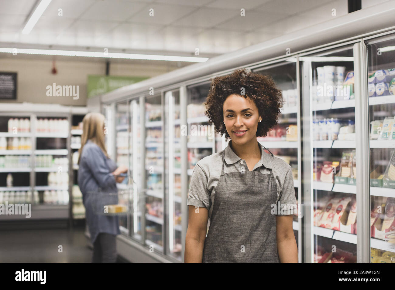Portrait of grocery store sales assistant Stock Photo