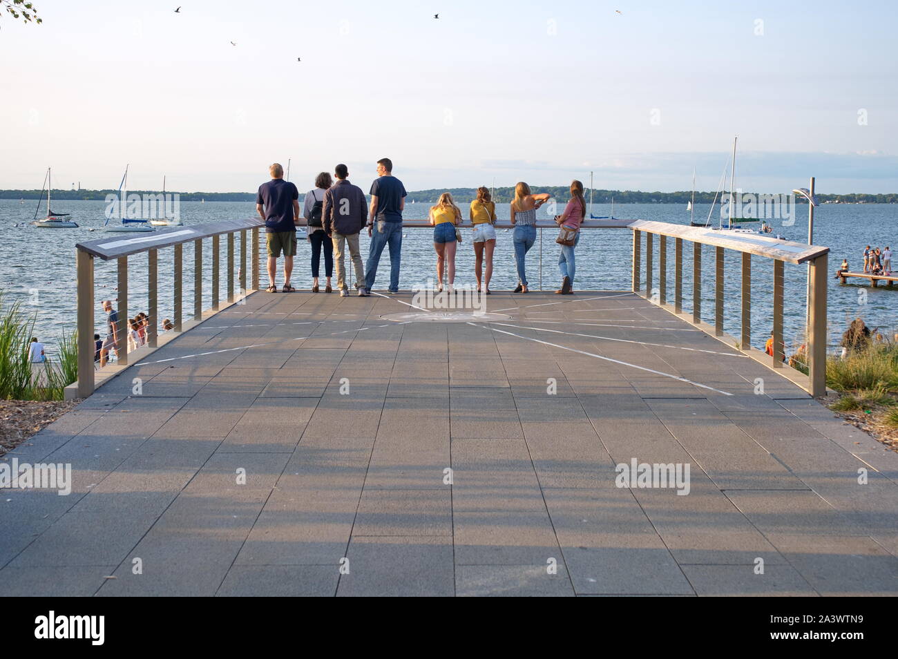 Madison, WI USA. Jul 2018. Students and visitors enjoying, eating, and waiting for the setting sun at the Alumni Park. Stock Photo