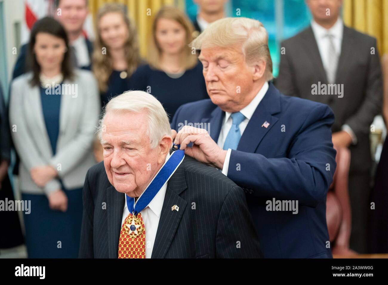 U.S President Donald Trump presents former Attorney General Edwin Meese with the Presidential Medal of Freedom during a ceremony in the Oval Office of the White House October 8, 2019 in Washington, DC. Stock Photo