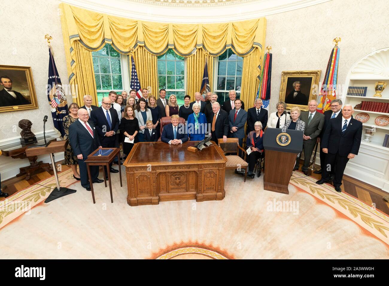 U.S President Donald Trump, officials and family members pose for a group photo after awarding former Attorney General Edwin Meese with the Presidential Medal of Freedom during a ceremony in the Oval Office of the White House October 8, 2019 in Washington, DC. Stock Photo