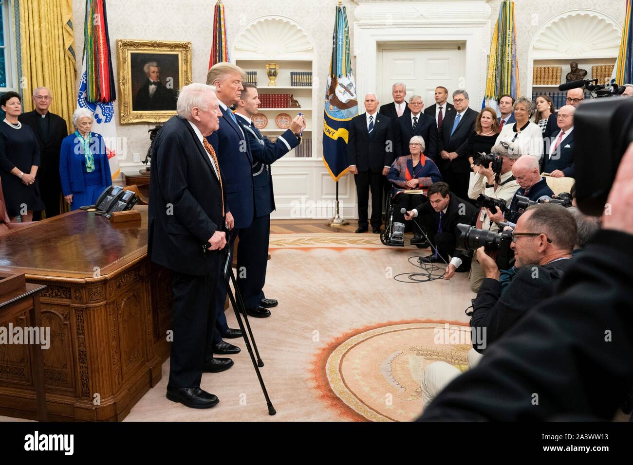 U.S President Donald Trump presents former Attorney General Edwin Meese, left, with the Presidential Medal of Freedom during a ceremony in the Oval Office of the White House October 8, 2019 in Washington, DC. Stock Photo