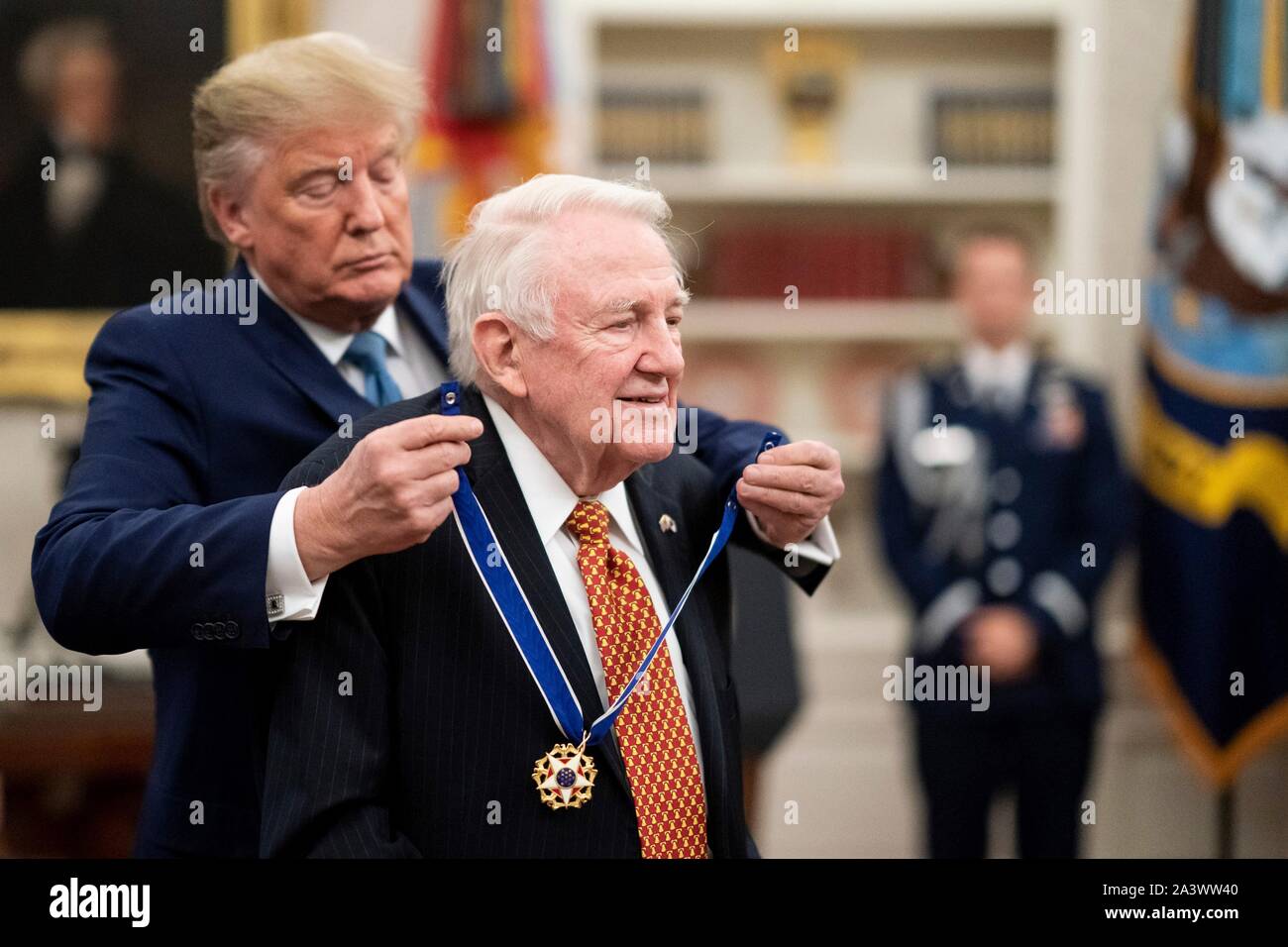 U.S President Donald Trump presents former Attorney General Edwin Meese with the Presidential Medal of Freedom during a ceremony in the Oval Office of the White House October 8, 2019 in Washington, DC. Stock Photo