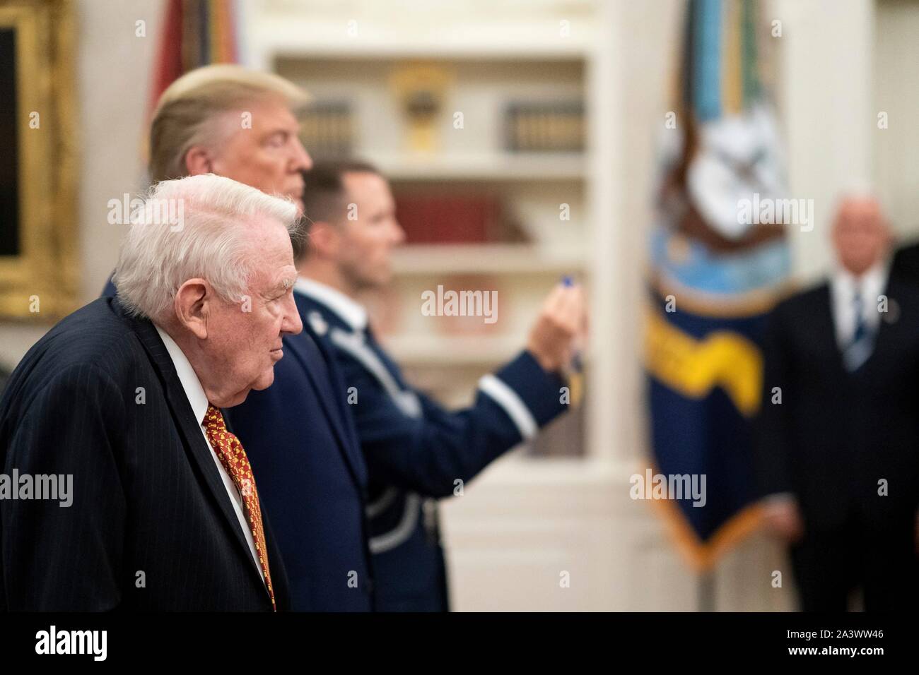 U.S President Donald Trump presents former Attorney General Edwin Meese with the Presidential Medal of Freedom during a ceremony in the Oval Office of the White House October 8, 2019 in Washington, DC. Stock Photo