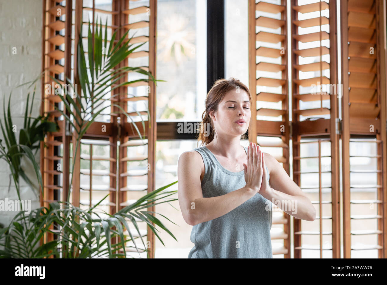 Young adult female practicing yoga Stock Photo