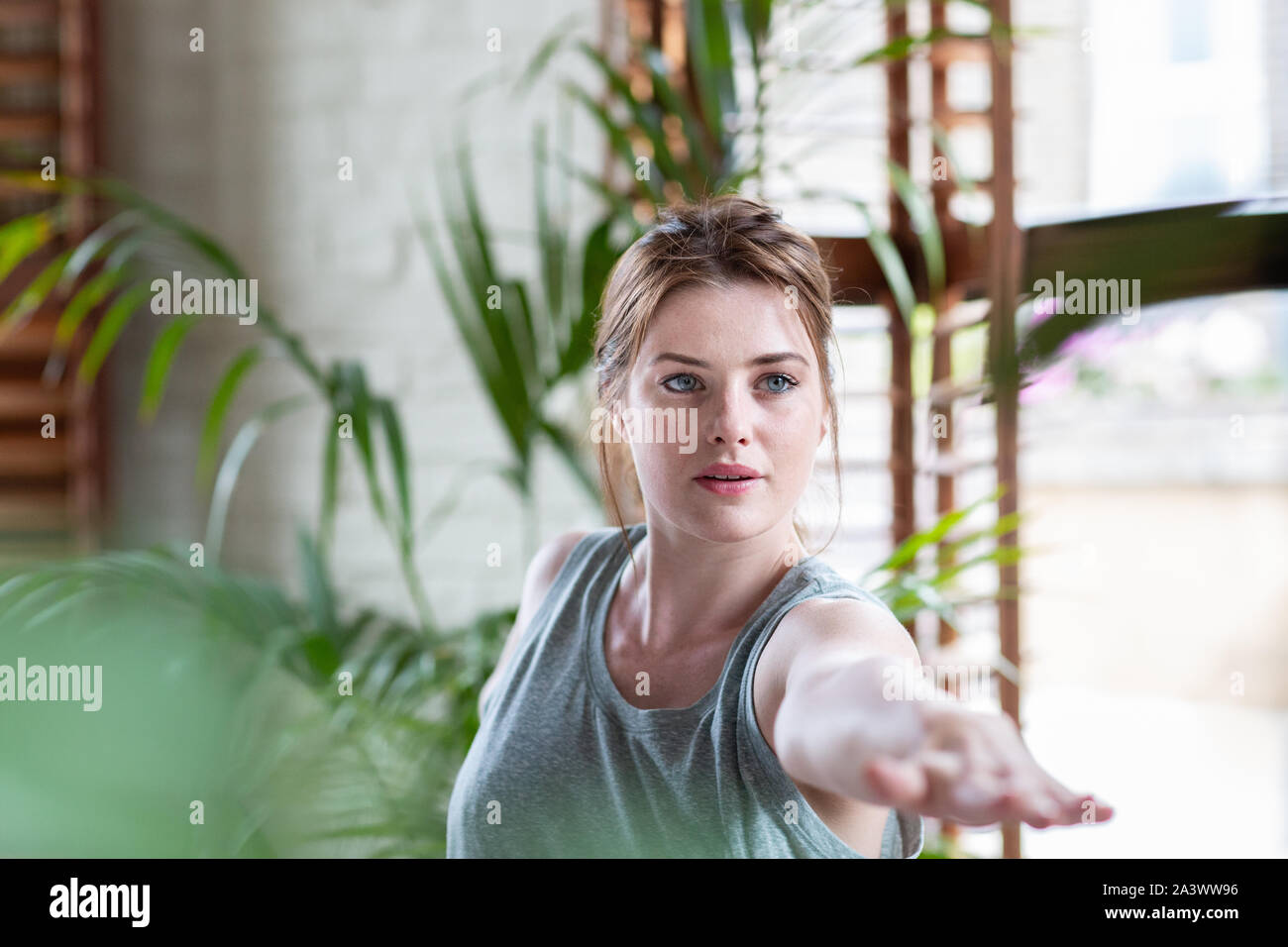 Young adult female practicing yoga Stock Photo