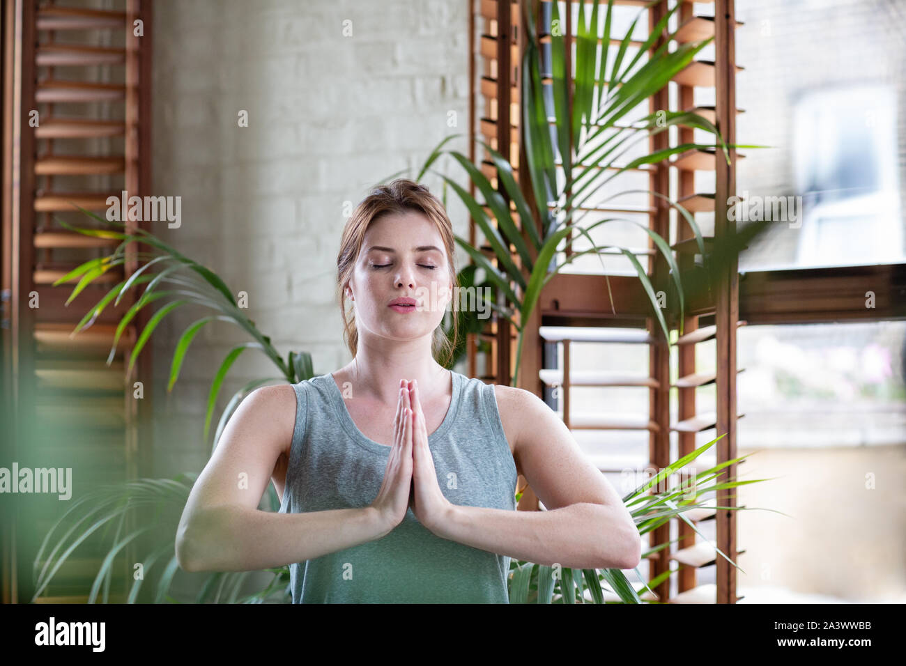 Young adult female practicing yoga Stock Photo