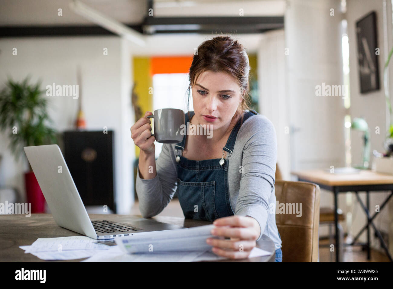 Young adult female online banking Stock Photo