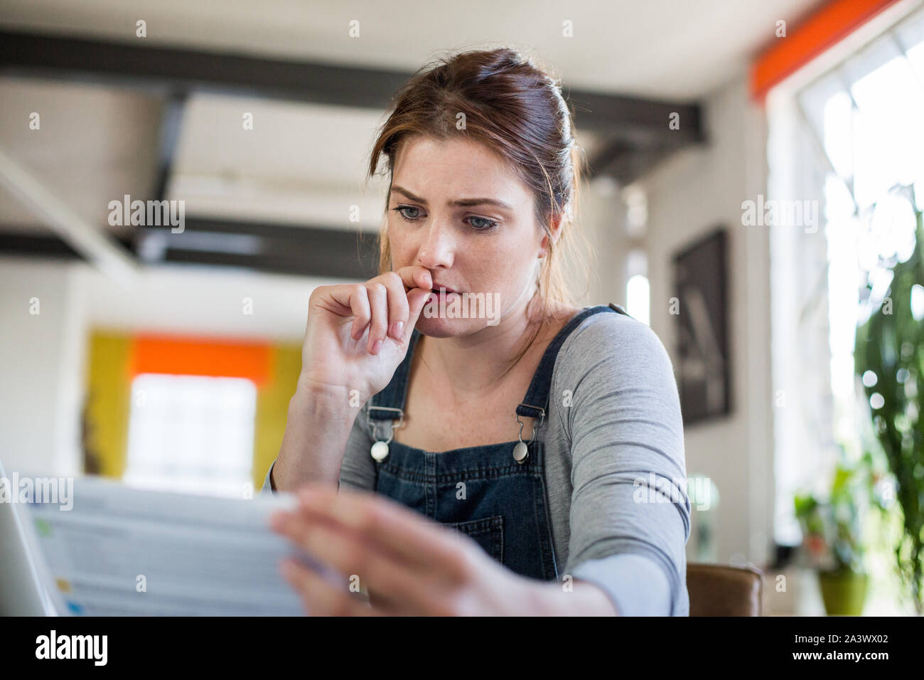 Young adult female online banking Stock Photo