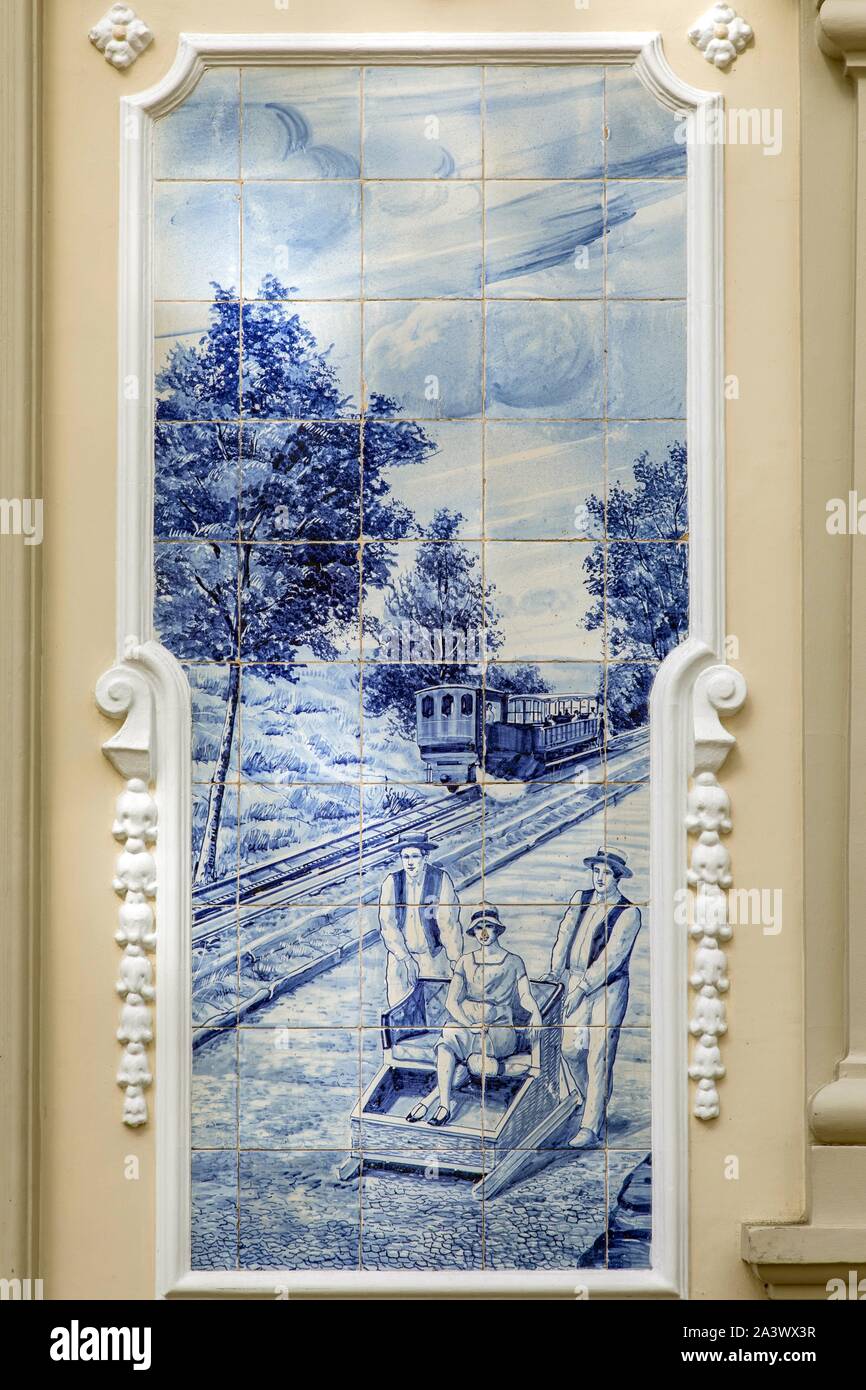 AZULEJOS OF PEOPLE GOING DOWN THE STREET IN A WICKER SLEIGH, ILLUSTRATION OF THE CITY IN THE PAST, FUNCHAL, ISLAND OF MADEIRA, PORTUGAL Stock Photo