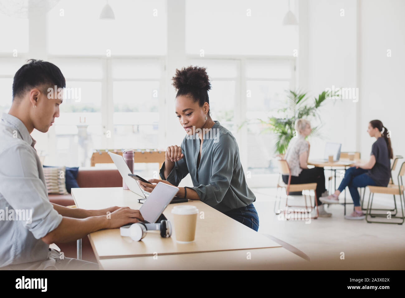 African American Woman working in a coworking space Stock Photo
