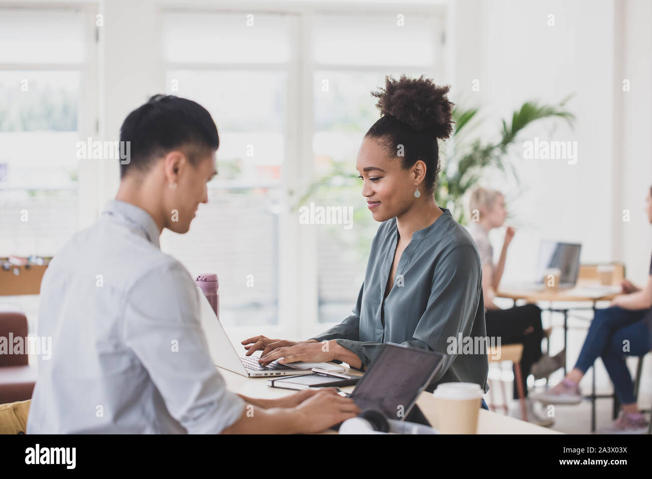 African American Woman working in a coworking space Stock Photo