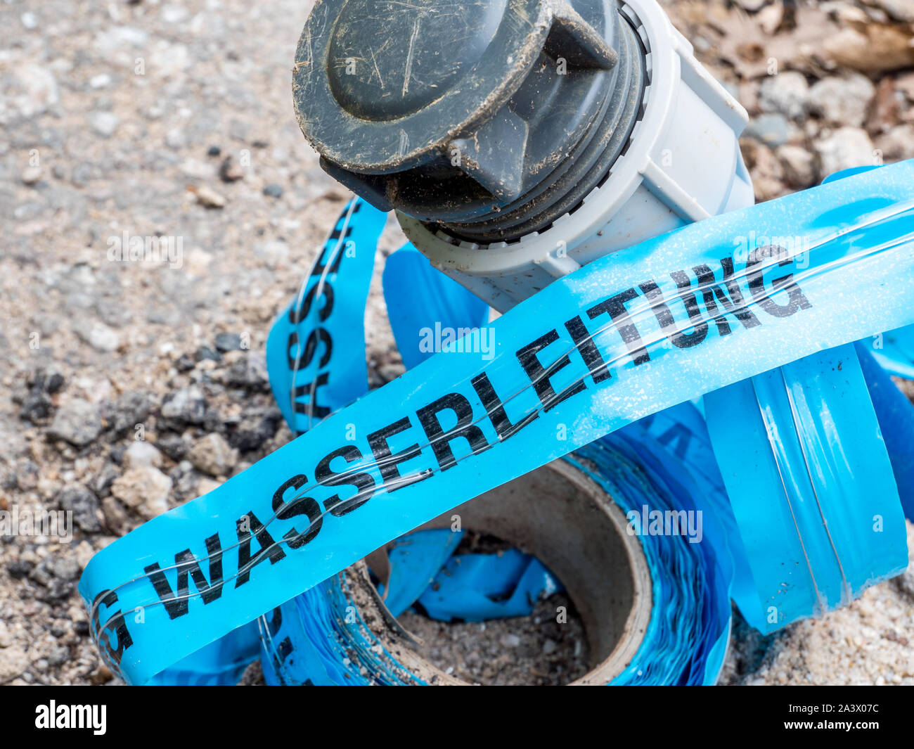 Route warning tape water pipe with water pipe Stock Photo Alamy