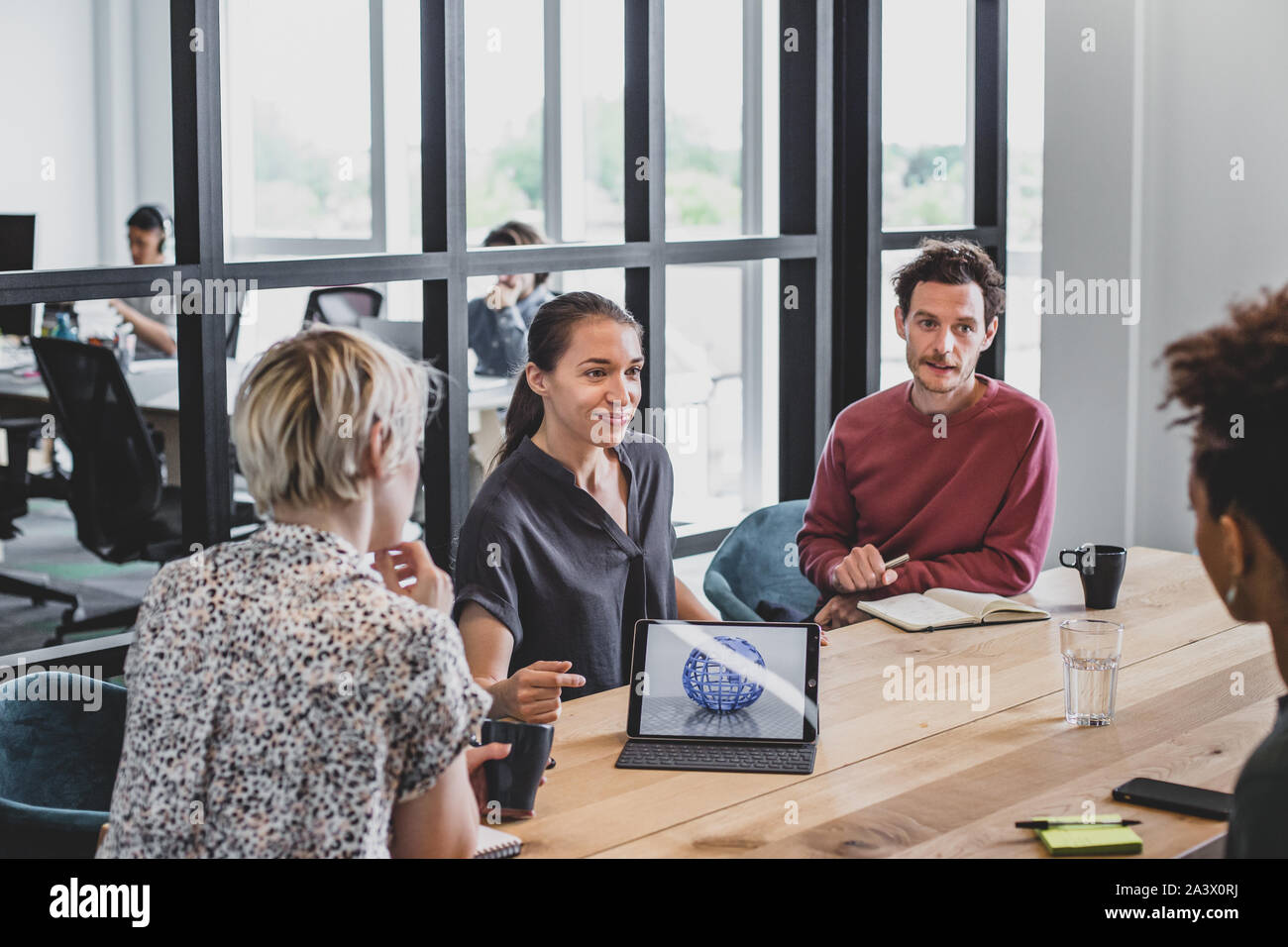 Hispanic businesswoman giving a presentation in a meeting Stock Photo