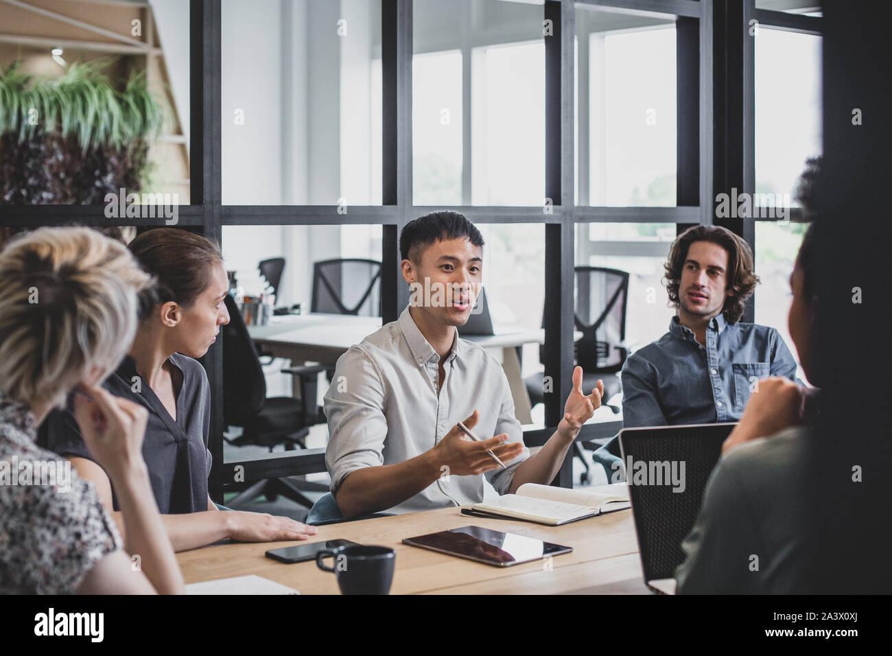 Asian businessman speaking in a meeting Stock Photo