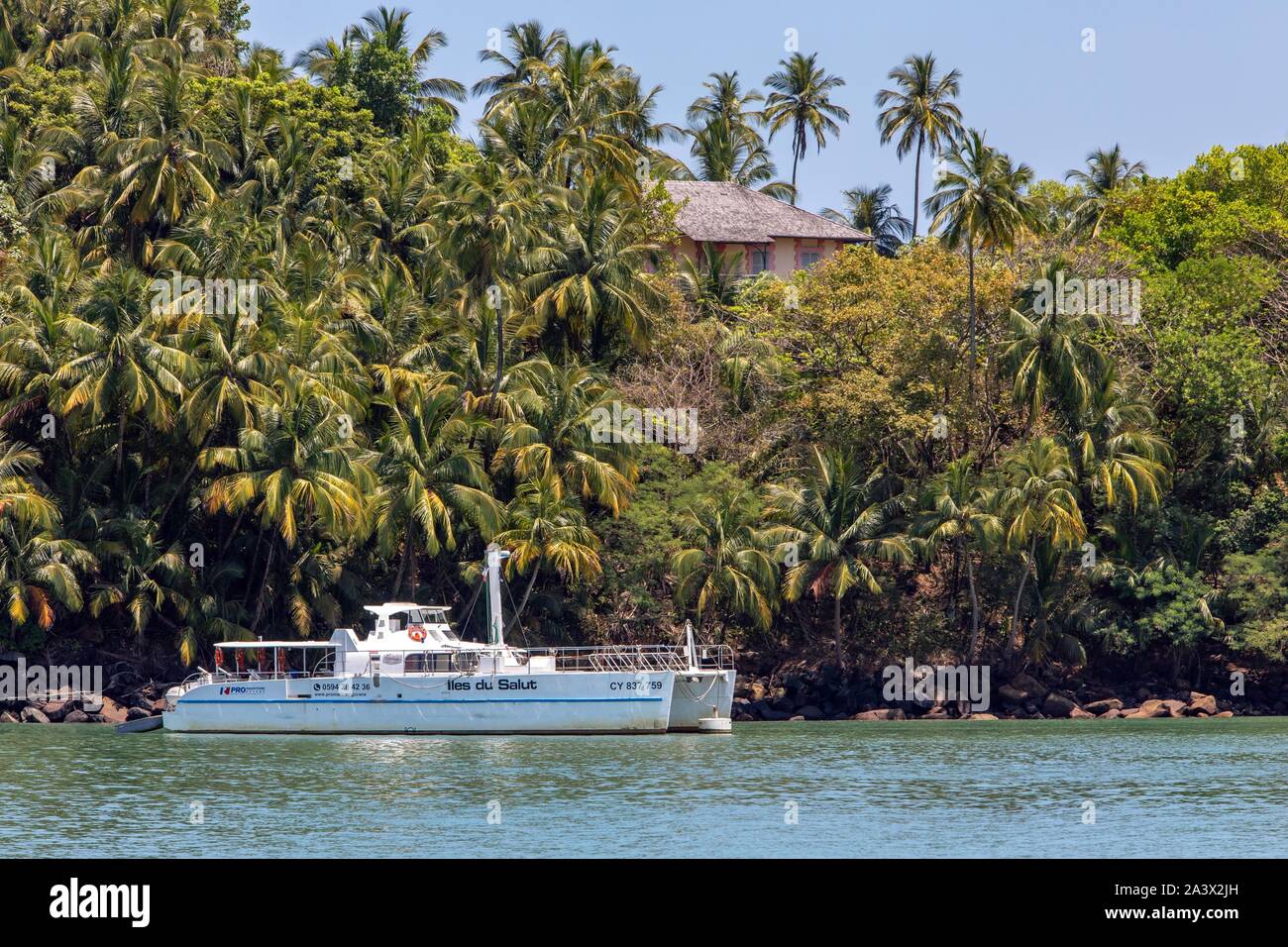 CATAMARAN IN FRONT OF ILE ROYALE, SALVATION'S ISLANDS, KOUROU, FRENCH GUIANA, OVERSEAS DEPARTMENT, SOUTH AMERICA, FRANCE Stock Photo