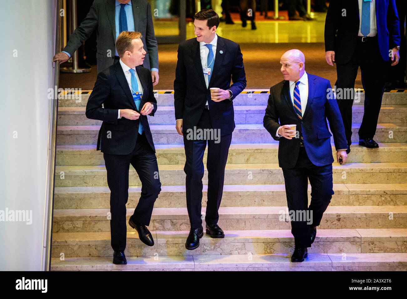 WEF President Børge Brende with Homeland Security advisor Tom Bossert (center) and National Security Advisor (Herbert Raymond) H. R. McMaster on their way down the stairs to listen to Donald Trump at an event at the World Economic Forum - WEF. Stock Photo