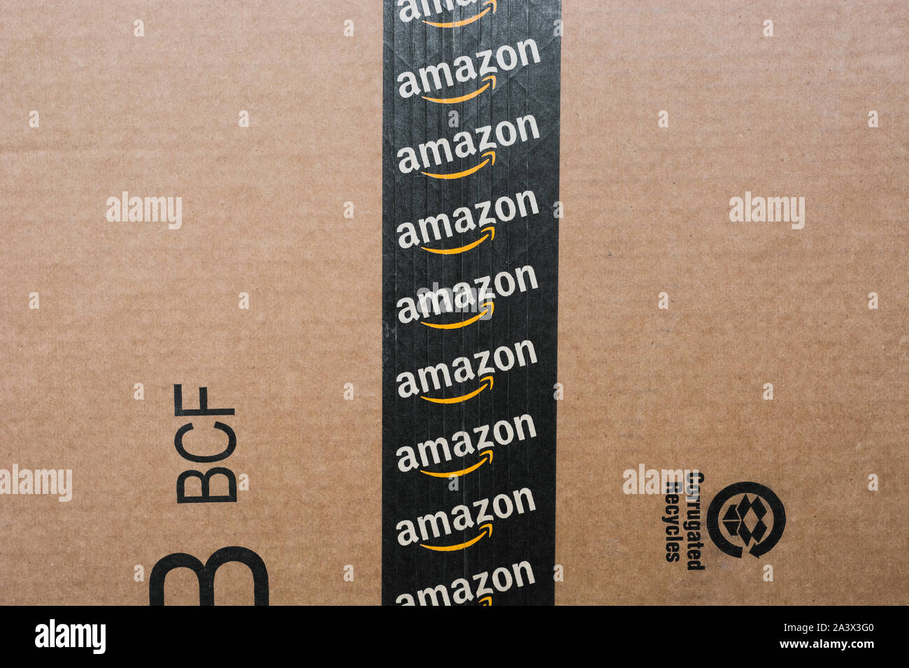 Monterrey, Mexico - Sept 3,0 2019: Amazon standard shipping box. Amazon logotype printed on cardboard box security scotch tape. Frontal view Stock Photo