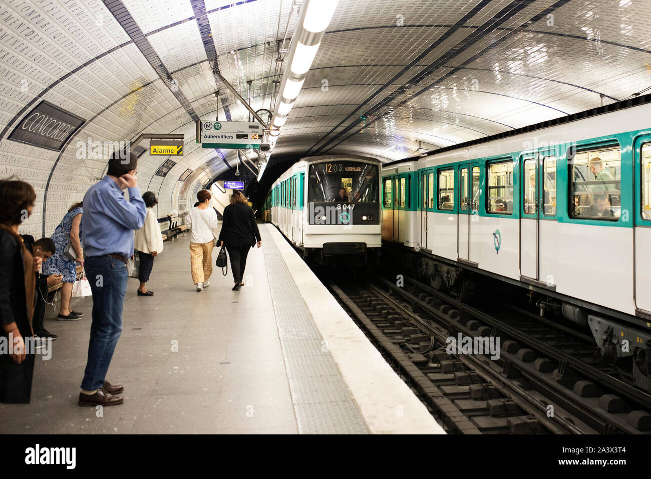 A train arriving into the Concorde metro station in Paris, France. Stock Photo