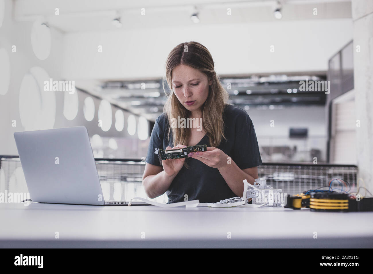 Female working on robotics Stock Photo