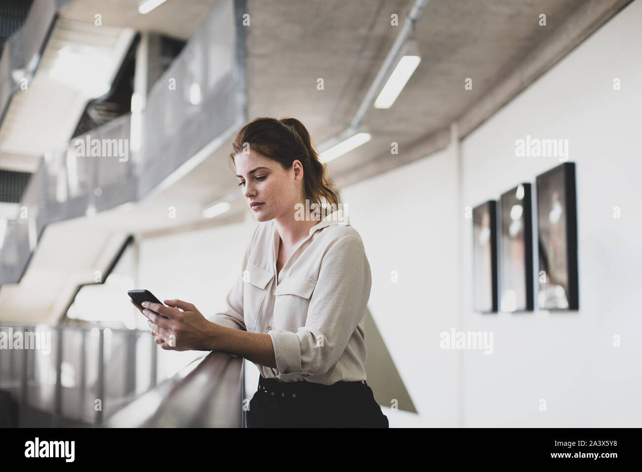 Businesswoman working using smartphone hi-res stock photography and ...