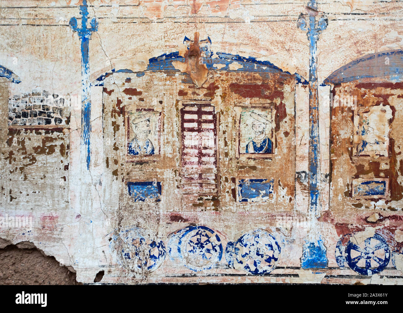 Wall paintings depicting indian people in a train on an old haveli, Rajasthan, Nawalgarh, India Stock Photo