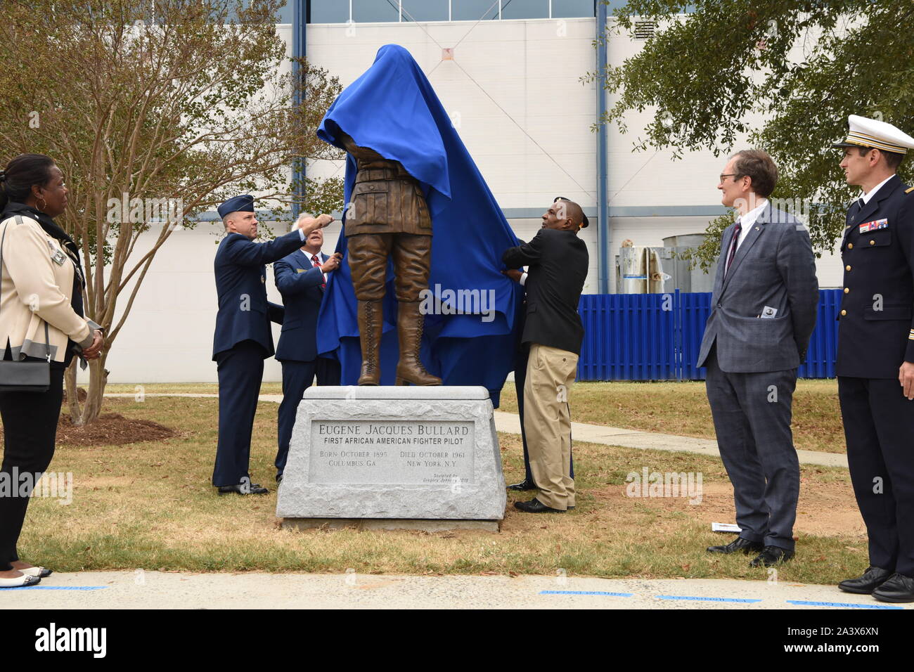 Warner Robins, United States. 09 October, 2019. Military officials and family members watch as a statue of 2nd Lt. Eugene Jacques Bullard, the first African American fighter pilot, is unveiled during a ceremony at the Museum of Aviation on Warner Robins Air Force Base October 9, 2019 in Warner Robins, Georgia. The statue was donated to the United States Air Force by the Georgia World War I Centennial Commission.  Credit: Tommie Horton/Planetpix/Alamy Live News Stock Photo
