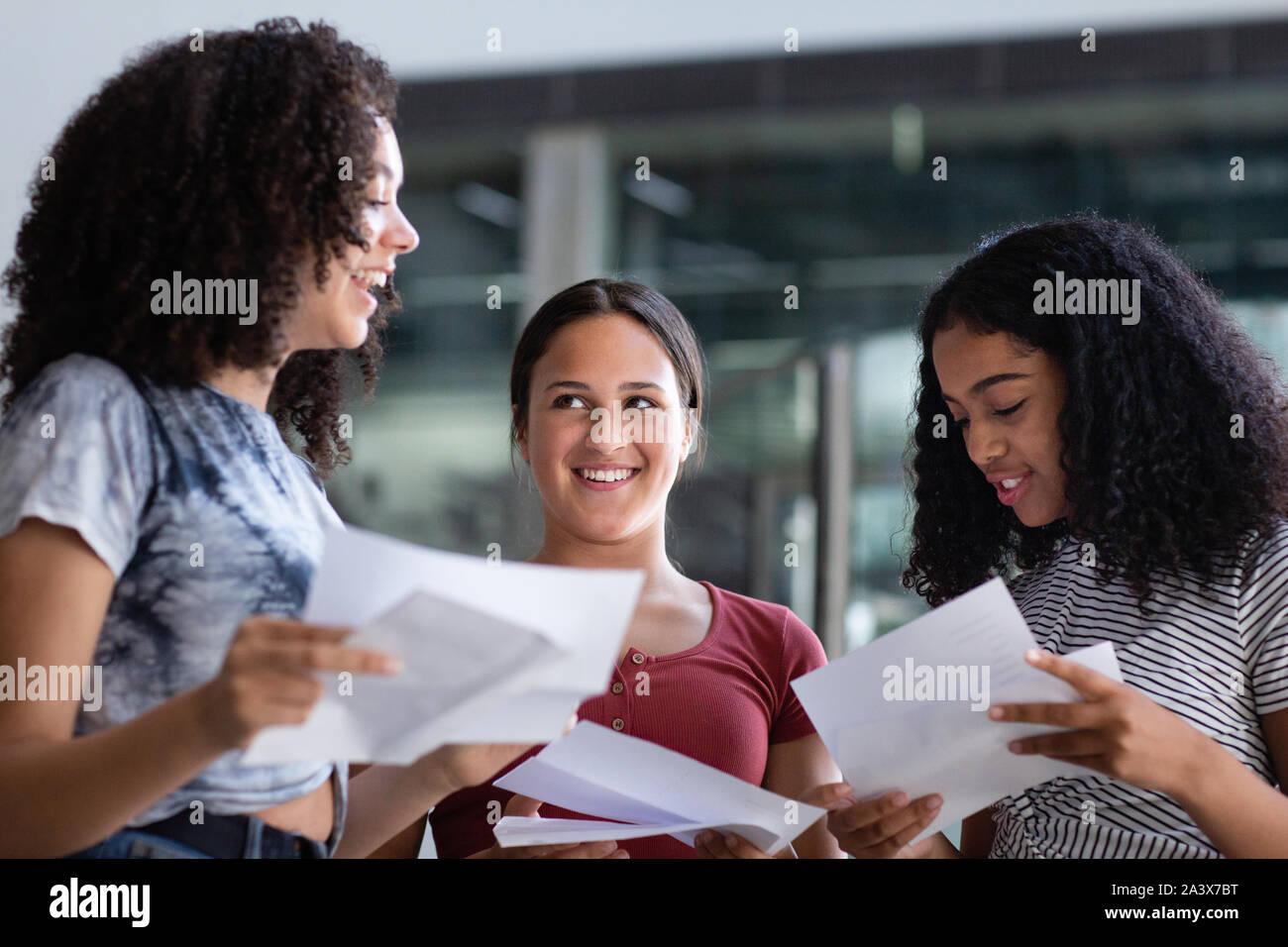 Female High school students opening their exam results Stock Photo