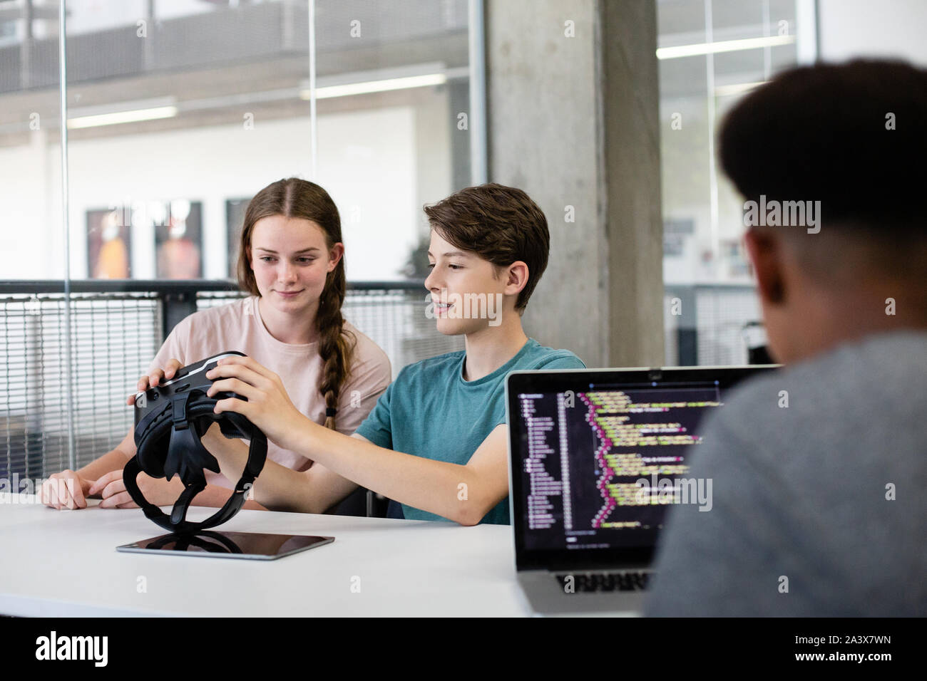 High school students using VR headset in class Stock Photo