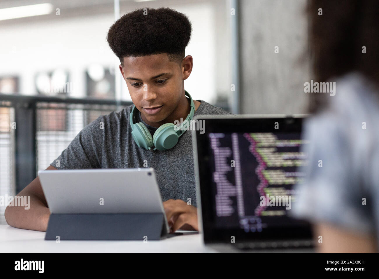 African American male student coding in class Stock Photo