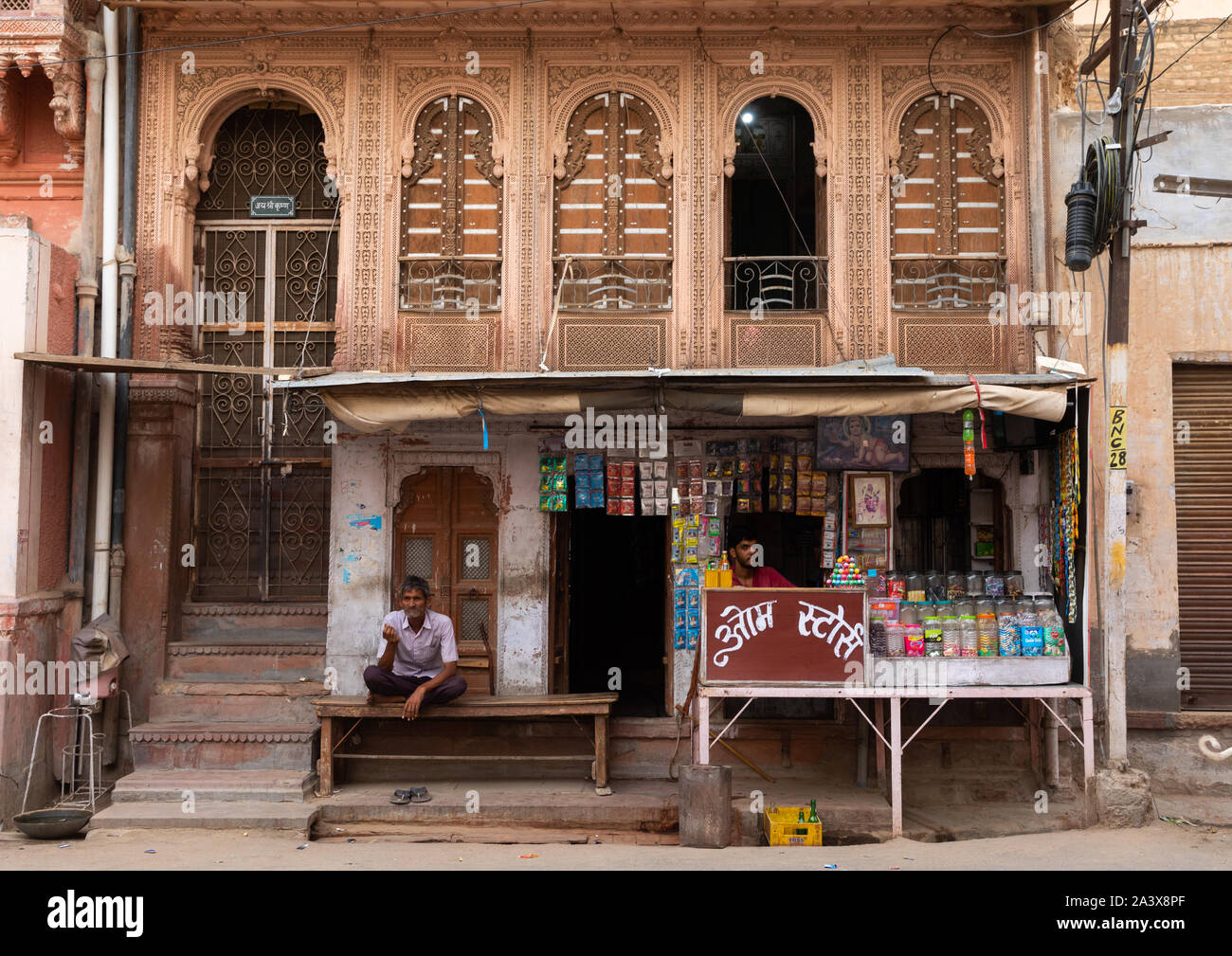 Small food stall in front of a haveli in the old city, Rajasthan