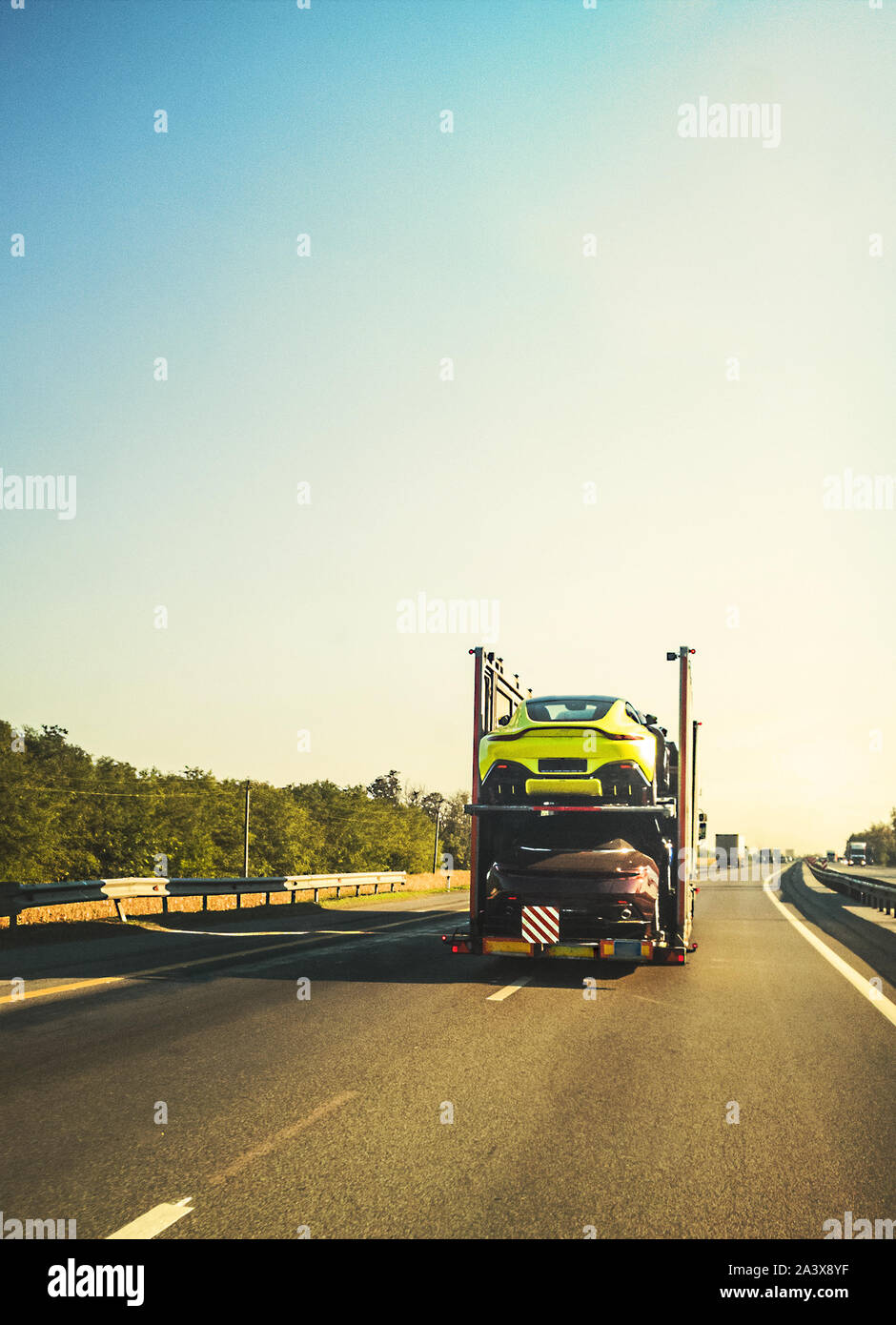 rack-truck laden with sport cars Stock Photo